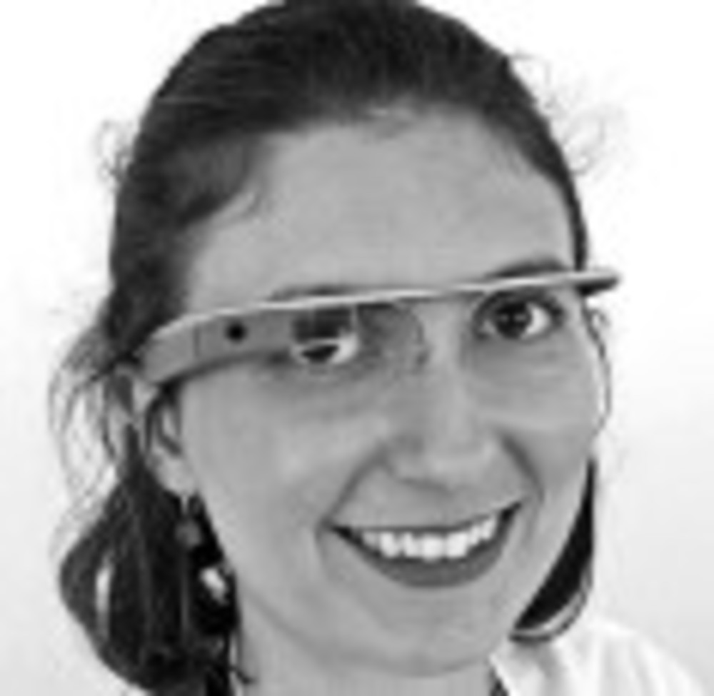 A woman wears Google Glass.